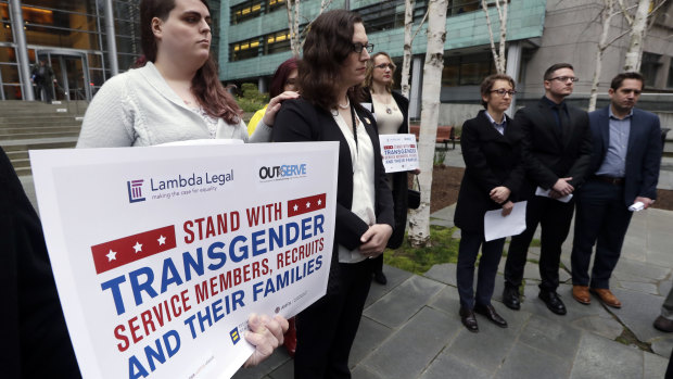 Transgender-rights activists protest outside a US federal court.