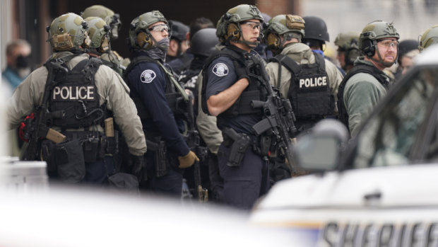 Police work on the scene outside a King Soopers grocery store where a shooting took place in Boulder, Colorado.