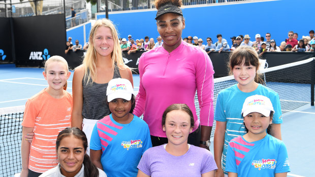 Fighting for the future: Serena Williams, a leading advocate for equal gender prizemoney at all tournaments, poses with junior Australian tennis players at Melbourne Park.