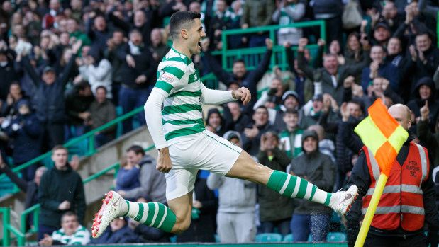 Pivotal: Tom Rogic celebrates his goal in the Scottish Premier League clash with Hibs.