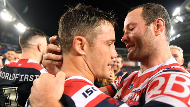 Storied episode: Cooper Cronk and Boyd Cordner embrace after the halfback's amazing feat of playing injured.