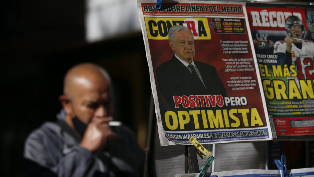 A newspaper’s front page carries the Spanish headline “Positive but optimistic” for the story about Mexican President Andres Manuel Lopez Obrador having COVID-19.