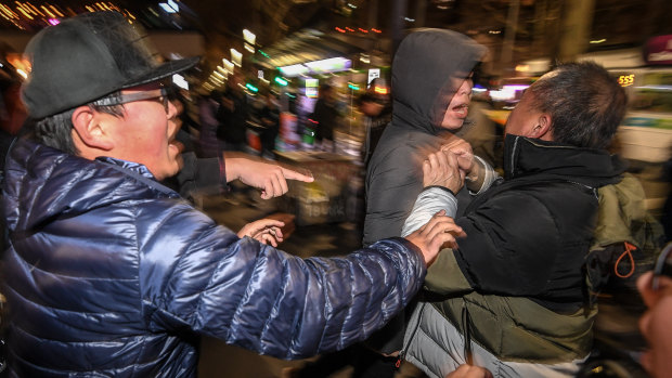 Rival protesters clash outside Melbourne's State Library.