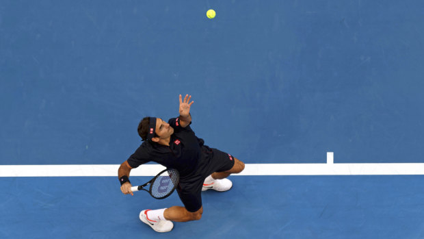 Serving it up: Switzerland's Roger Federer during his match against Stefanos Tsitsipas of Greece at the Hopman Cup in Perth.