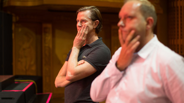 Resident director David Spencer and journalist Nathanael Cooper watch a rehearsal of Priscilla.