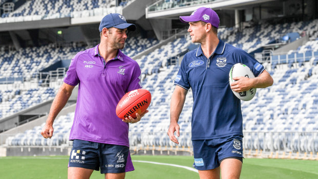 Melbourne Storm captain Cameron Smith with Geelong skipper Joel Selwood on Friday.