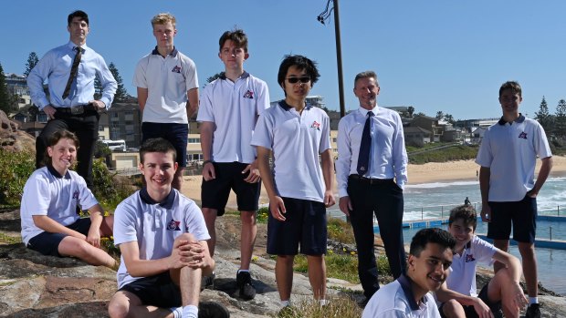 Back to basics: Balgowlah Boys' High deputy principal Benjamin Seldon (left) with principal Paul Sheather and students. The school has seen sharp improvements in writing skills.