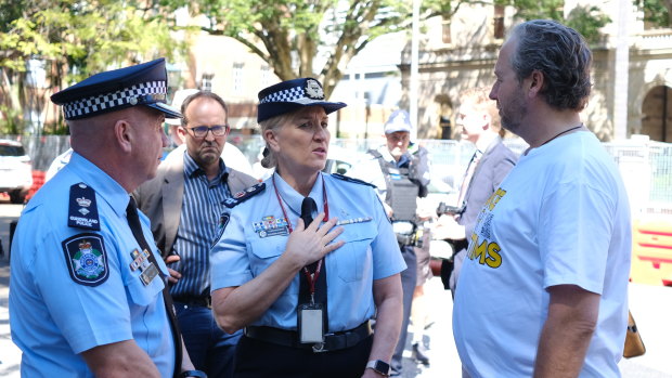 Queensland Police Commissioner Katarina Carroll meets with Voices for Victims’ Ben Cannon outside parliament.