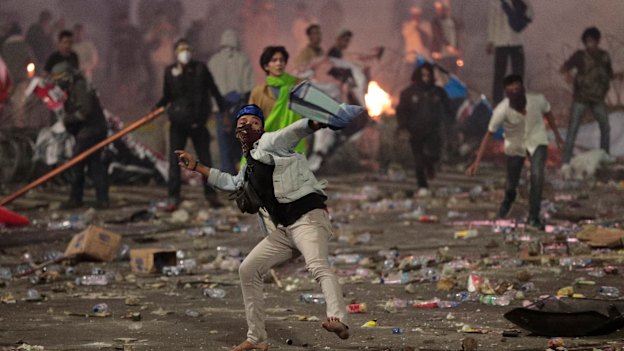 Protesters threw rocks at police and army on the streets of Jakarta.