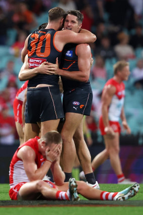 Matt Flynn and Jesse Hogan embrace after the Giants’ victory over the Swans earlier this season.