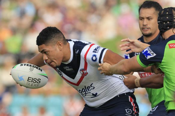 Tukupa Hau Tapuha tries to break free for the Roosters.