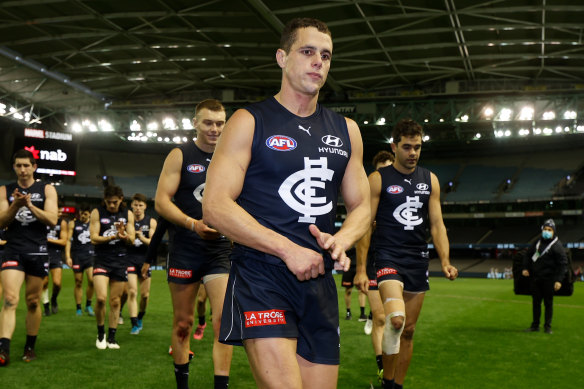 A shattered Ed Curnow leaves the field after his 200th match.