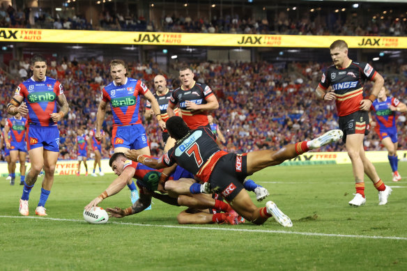 Knight’s and NSW centre Bradman Best scores a try against the Dolphins.