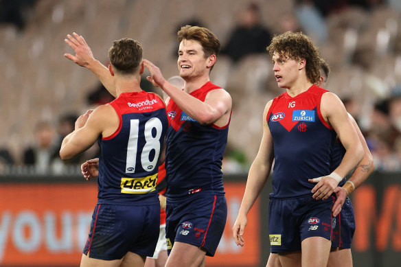 Bayley Fritsch of the Demons celebrates kicking a goal.