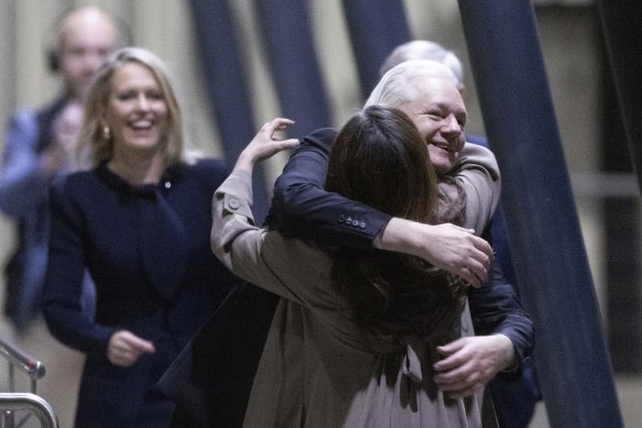 Stella Assange greets her husband on his arrival.