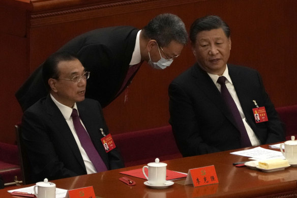 Chinese Premier Li Keqiang, left, and President Xi Jinping attend the closing ceremony of the 20th National Congress of China’s ruling Communist Party at the Great Hall of the People in Beijing.