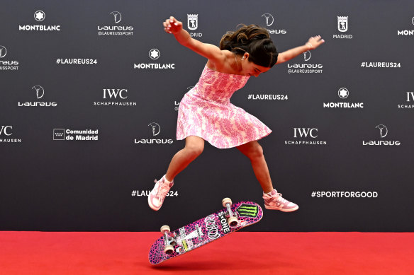 Arisa Trew arrived at the ceremony in Madrid with her trusty skateboard in tow.