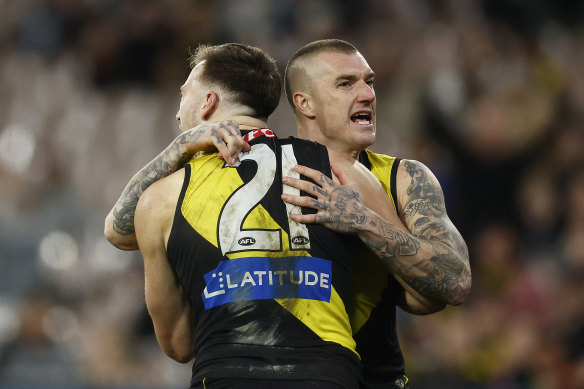 Noah Balta and Dustin Martin celebrate a key Tigers goal.