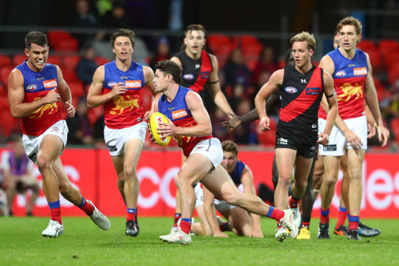 Lachie Neale breaks free as the Lions dominated the Bombers on Friday night.