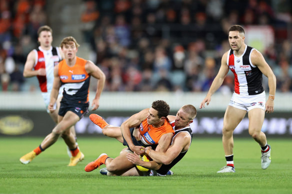 Josh Kelly is tackled by Seb Ross.