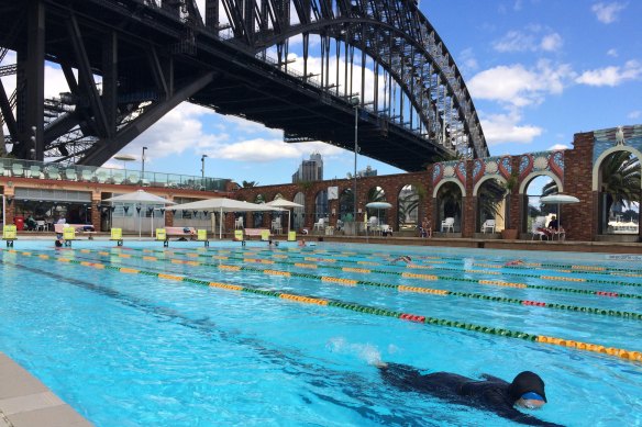 The art deco brick wall at the pool, built in 1936, features scallop shells and parrots moulded from stucco.