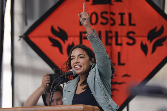 Democrat Alexandria Ocasio-Cortez speaks at a New York rally to end the use of fossil fuels.