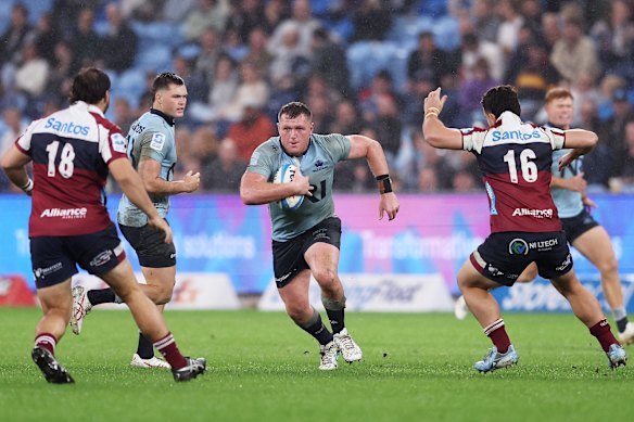 Angus Bell takes a carry for the Waratahs. 