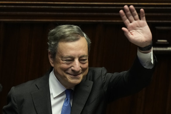 Italian PM Mario Draghi waves to MPs at the end of his address at the Parliament in Rome on Thursday.