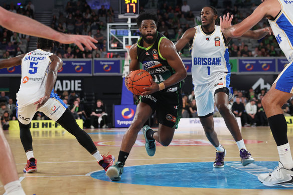 Phoenix import Derrick Walton Jr making the play on Saturday against the Brisbane Bullets.