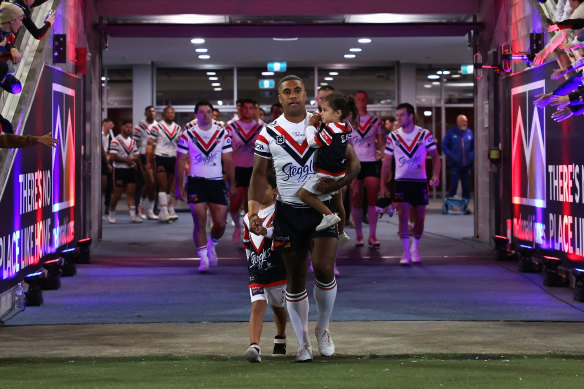 Michael Jennings leads the Roosters on to McDonald Jones Stadium on Thursday night.