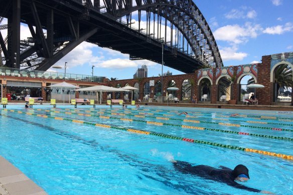 The art deco brick wall at the pool, built in 1936, features scallop shells and parrots moulded from stucco.