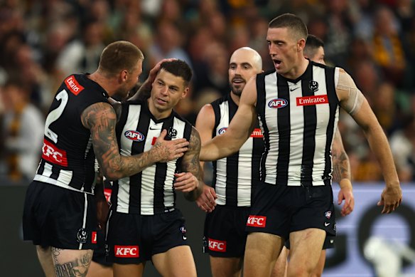 Jamie Elliott of the Magpies celebrates after scoring a goal.