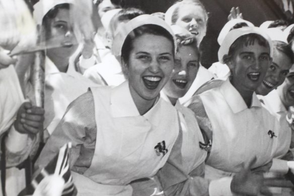Elinor Wrobel (front left) as a young woman, cheering as the Queen passed by.