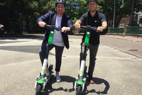 Lime's head of government relations Mitchell Price (left) and operations manager Ian Brouckaert with the Generation 3 scooter in Brisbane. 