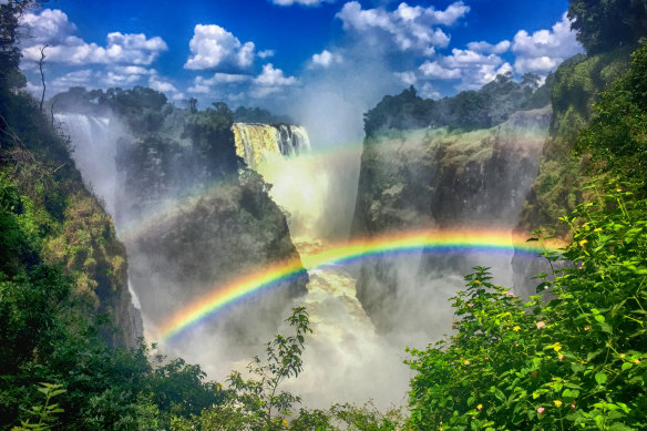 Bright sunlight of the dry season creates spectacular rainbows.