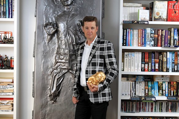 Matthew Reilly, pictured in 2014, with some of his movie collection. 