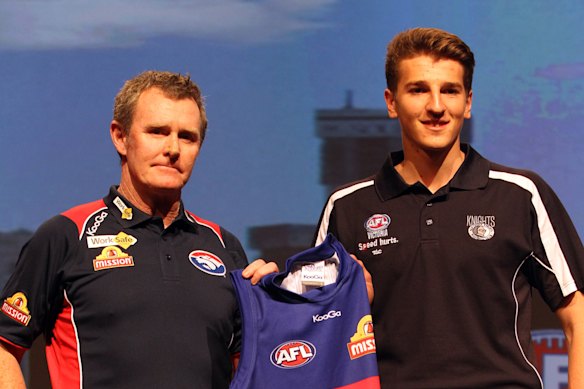 Marcus Bontempelli collects his jumper from then coach Brendan McCartney on draft day in 2013.