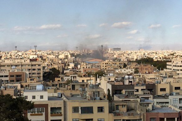 Smoke rises during a protest in the central Iranian city of Isfahan after authorities raised petrol prices.