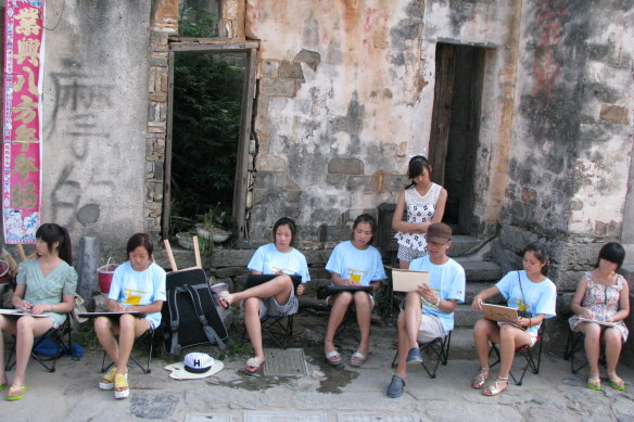 Wang Liqiang with other students at art school in Hong Kong.