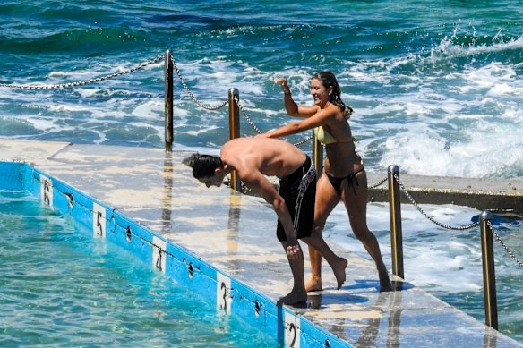 Swimmers cool off at Curl Curl after the thunderstorm passed over the northern beaches.