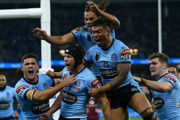 Matt Burton celebrates his try on debut for NSW.