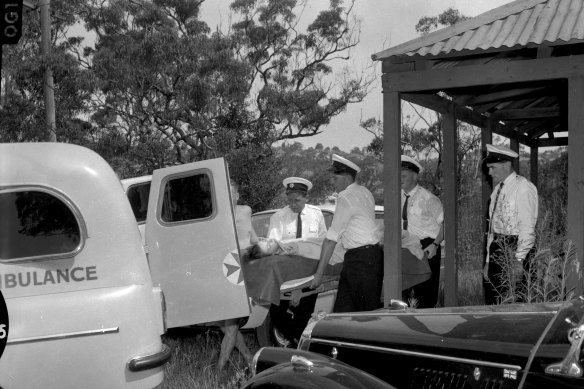 Shark-attack victim Marcia Hathaway is carried into a waiting ambulance on January 28, 1963