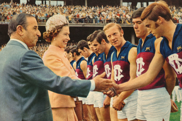Queen Elizabeth meets Fitzroy players during the first VFL match played on a Sunday, on April 5, 1970.