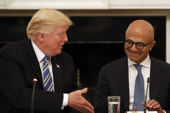 Donald Trump with Microsoft chief Satya Nadella. Amazon claimed the former US president stepped in to thwart its bid for the lucrative contract.