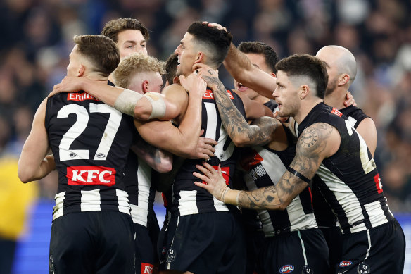 Scott Pendlebury celebrates Collingwood’s win in his 400th game.