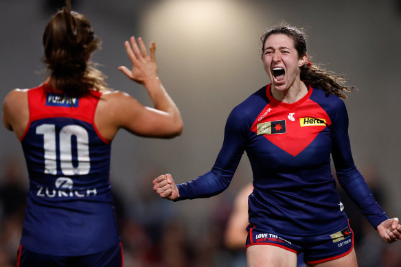 Alyssa Bannan celebrates a goal as the Demons sent a warning to the competition.