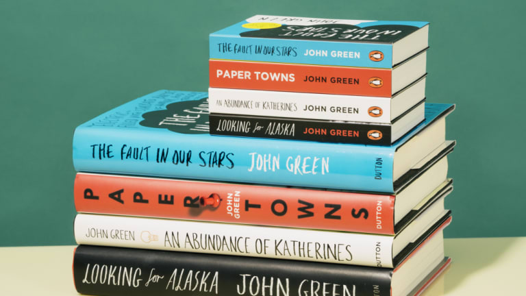 Mini book versions of works by John Green compared with their full-size counterparts.