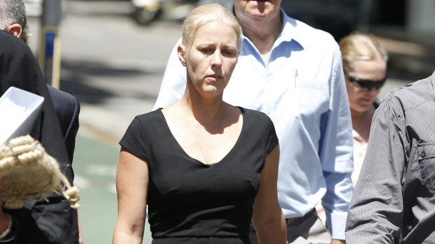 Heidi Strbak arrives with her lawyer and family members at the Supreme Court in Brisbane, on Tuesday.