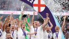 Ellen White and Jill Scott of England lift the trophy during the UEFA Women’s Euro 2022 final match between England and Germany at Wembley Stadium on July 31.