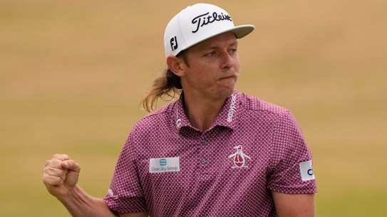 Cameron Smith celebrates on the 18th green after holing the winning birdie putt.